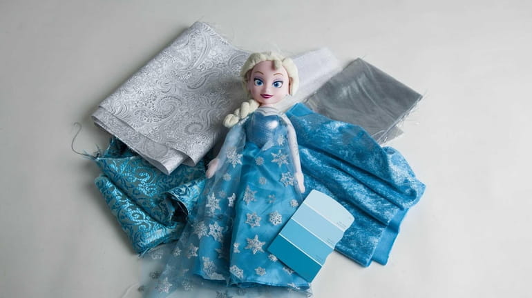An Elsa doll inspired by the movie "Frozen" can be...