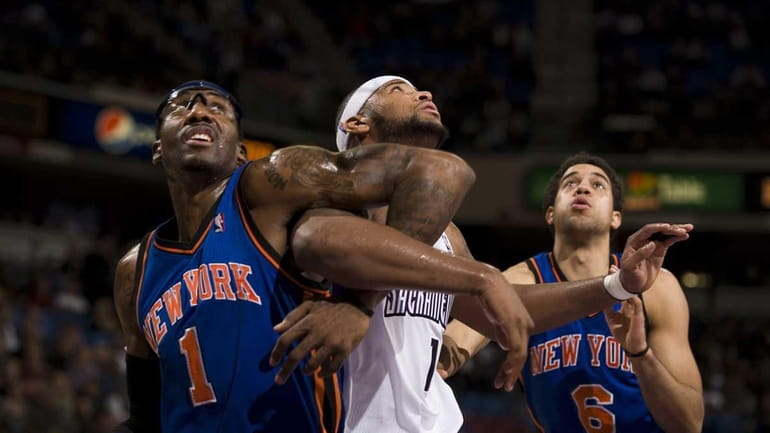 Sacramento Kings' DeMarcus Cousins, middle, and New York Knicks' Amar'e...