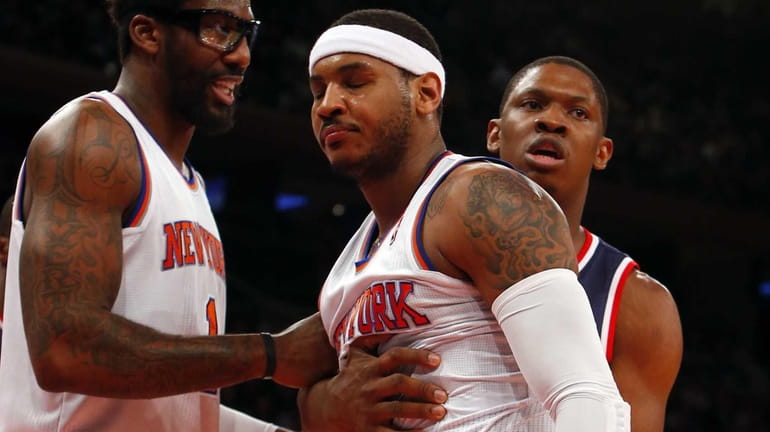 Carmelo Anthony and Amar'e Stoudemire react to a call during...