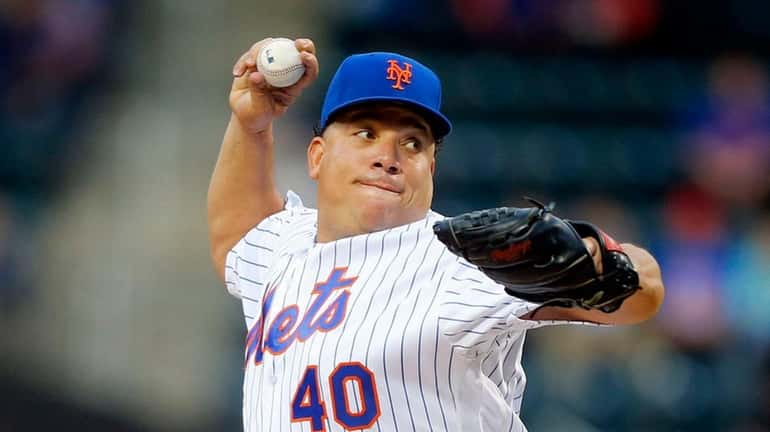 Bartolo Colon of the New York Mets pitches in the...