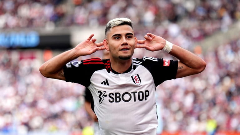 Fulham's Andreas Pereira celebrates scoring his side's second goal during...