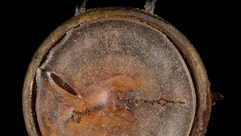 This photo provided by RR Auction shows a watch melted...