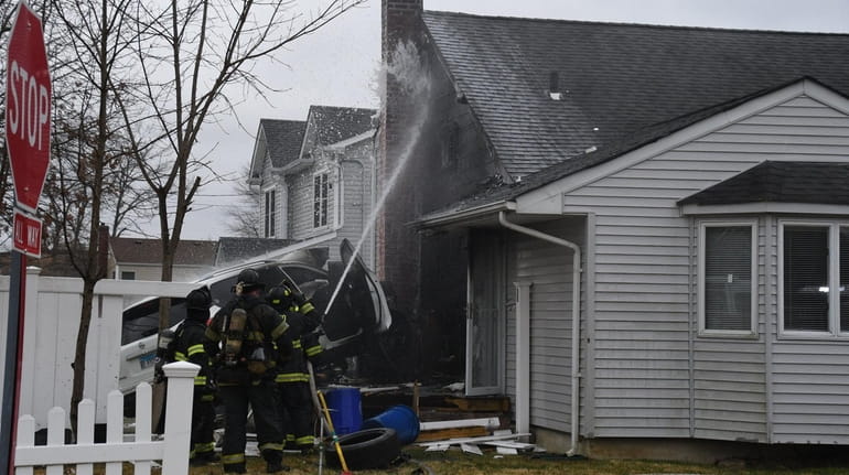 A house at the corner on Elkton Lane in North Babylon caught fire Friday...