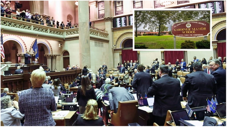 Assembly members applaud after passing the Child Victims Act in...