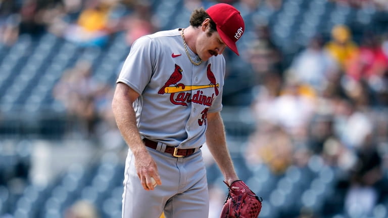 St. Louis Cardinals starting pitcher Miles Mikolas collects himself after...
