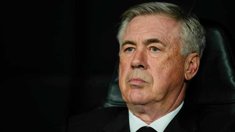 Real Madrid's head coach Carlo Ancelotti looks out from the...