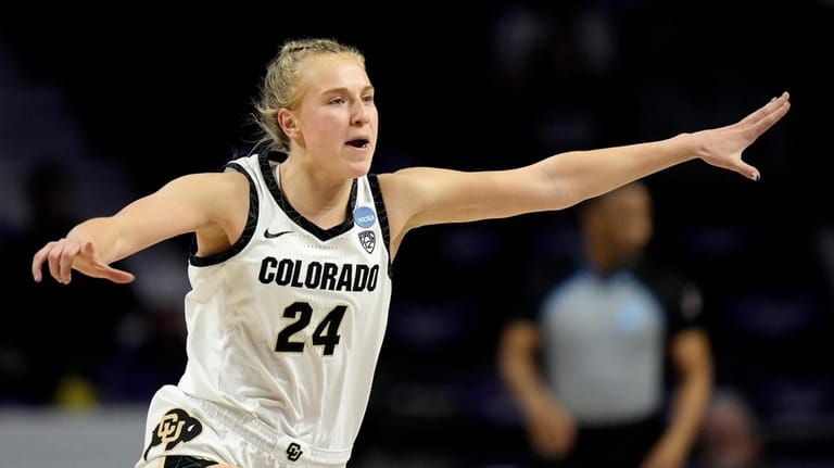 Colorado guard Maddie Nolan (24) celebrates after making a basket...