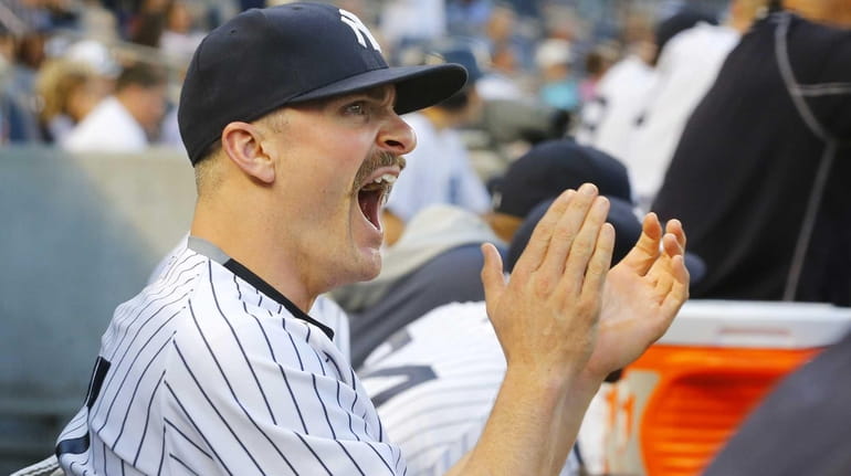 Brendan Ryan of the New York Yankees looks on from...