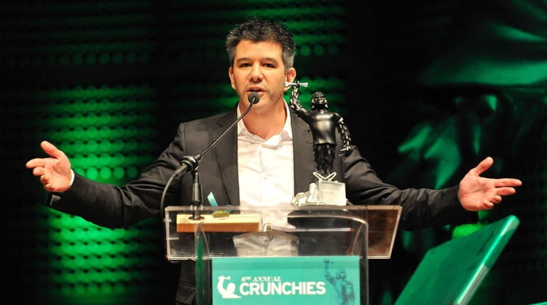 Travis Kalanick of Uber collects the award for Best Overall...