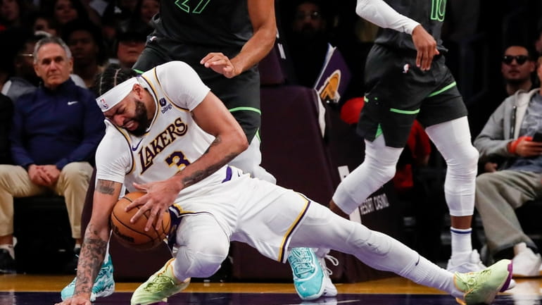 Los Angeles Lakers forward-center Anthony Davis (3) slips during the...