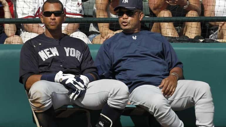 Yankees third baseman Alex Rodriguez, left, listens to Hall of...