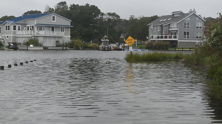 Moriches Bay spills over onto Laura Lee Drive in Center Moriches on...