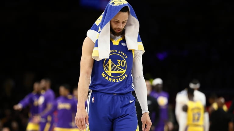 Golden State Warriors guard Stephen Curry stands during a timeout...