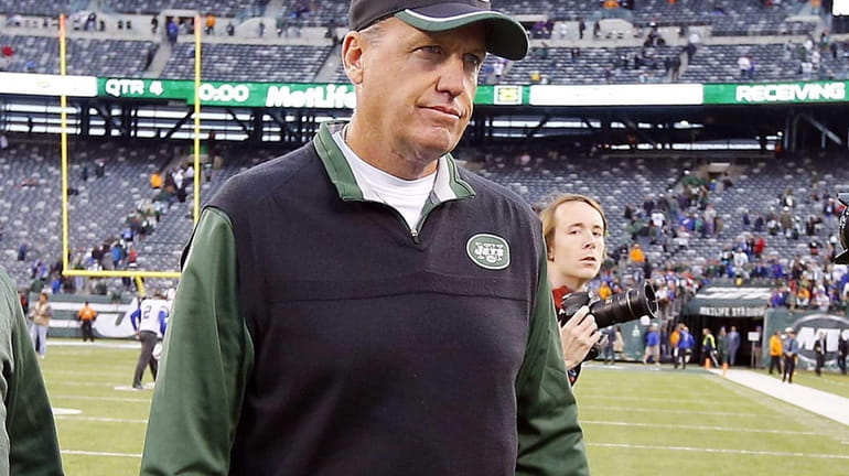 Head coach Rex Ryan of the Jets walks off the...