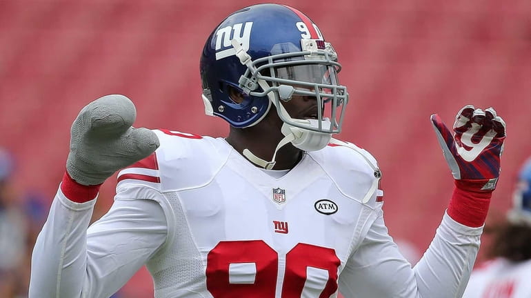 Jason Pierre-Paul of the New York Giants warms up during...
