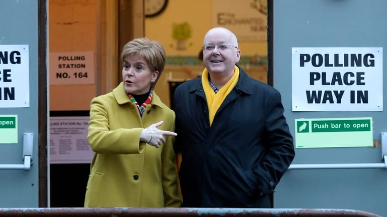 Scottish First Minister Nicola Sturgeon poses for the media with...