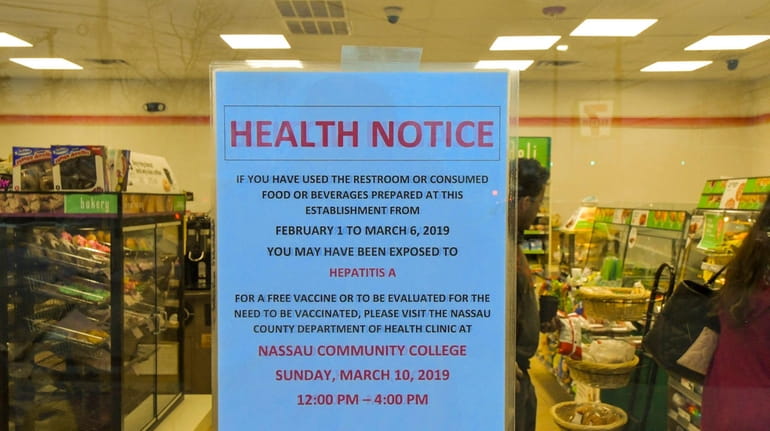 A health notice on the door of a Merrick 7-Eleven...