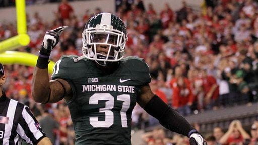 Michigan State's Darqueze Dennard (31) reacts during the second half...