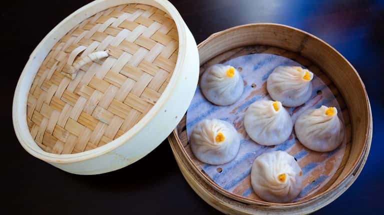 Steamed crabmeat and pork soup buns are served at Red...