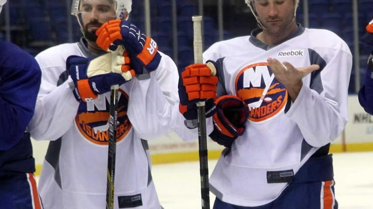 Islanders newest defensemen Nick Leddy and Johnny Boychuk stand on...