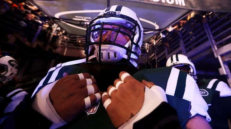 Nick Mangold #74 of the New York Jets takes the...
