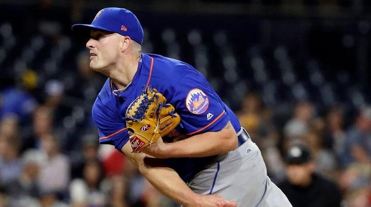Mets closer Addison Reed works against a San Diego Padres...