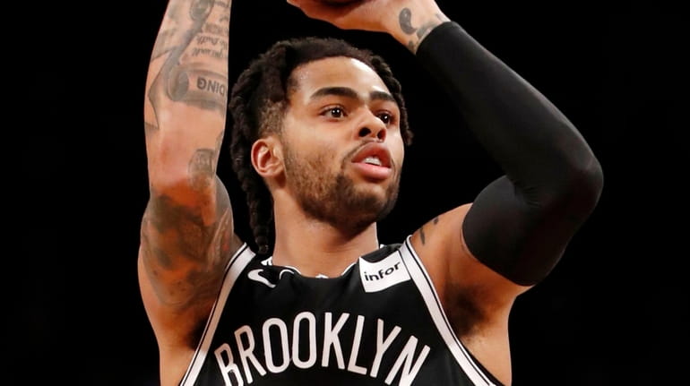 Nets guard D'Angelo Russell shoots a three-point shot against the Bulls...