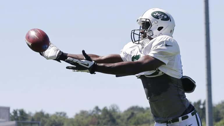 Jets wide receiver Stephen Hill reaches for a pass during...