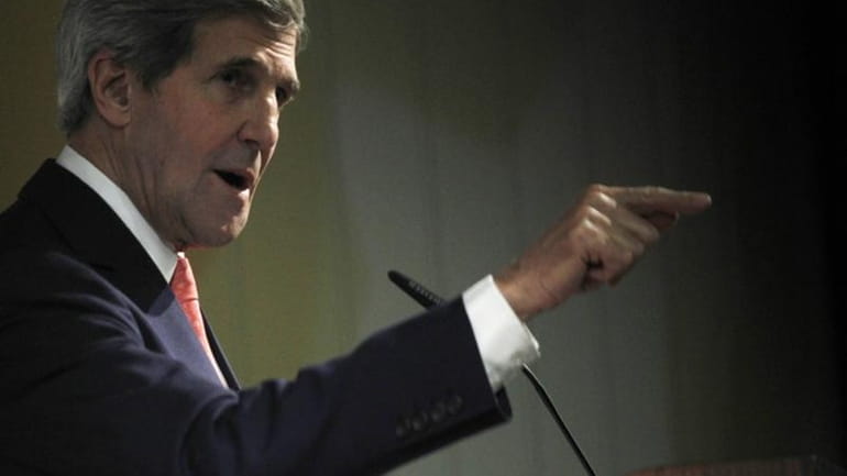 U.S. Secretary of State John Kerry gestures while speaking at...