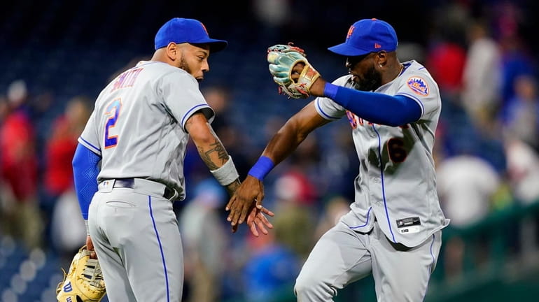 Mets' Dominic Smith, left, and Starling Marte celebrate after a...