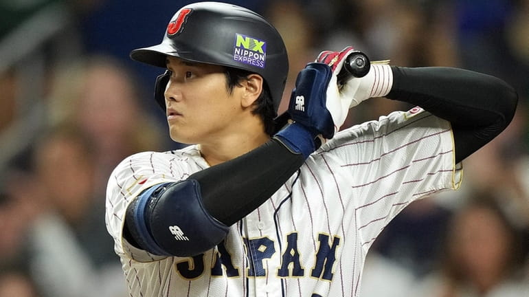 Shohei Ohtani of Team Japan bats in the first inning against...