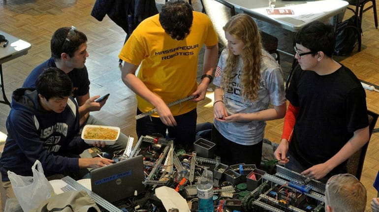 The team from Massapequa High School brainstorms during the VEX...