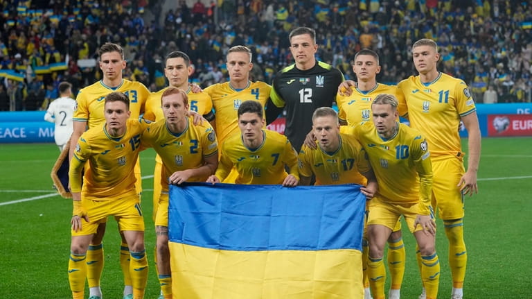FILE- Ukraine squad pose before the Euro 2024 group C...