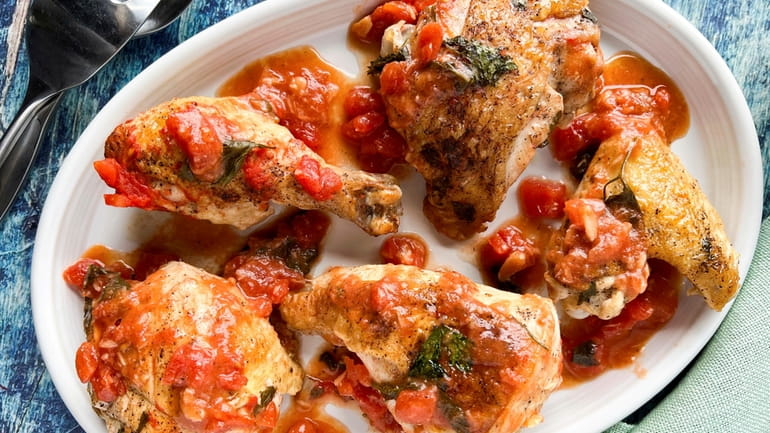 Chicken is cooked with vinegar, tomatoes and parsley in this...