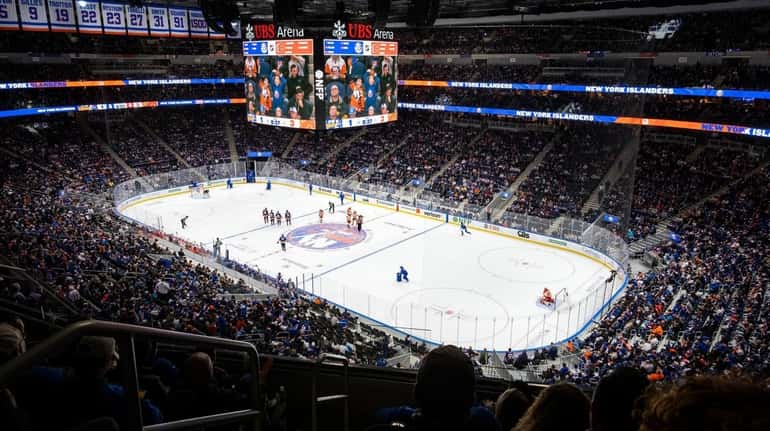 Islanders fans watch the second period of action at the...