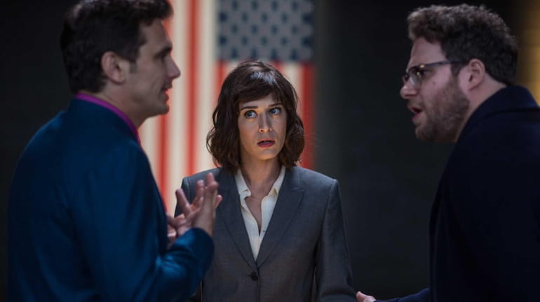 Lacey (Lizzy Caplan) with Dave (James Franco) and Aaron (Seth...