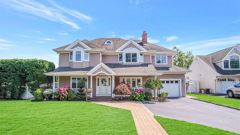 Priced at $1.175 million, this Colonial on Exeter Road feautres a...
