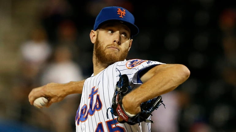 Zack Wheeler #45 of the Mets pitches during the first...