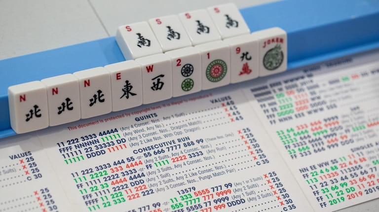Said to be similar to gin rummy, mah-jongg is described...