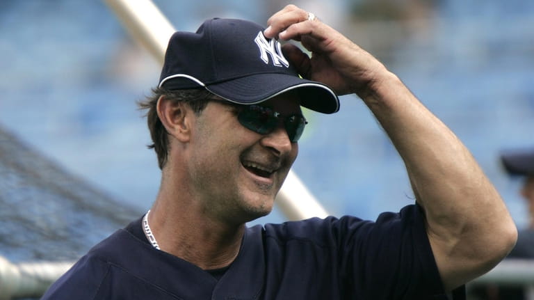 Former Yankees first baseman Don Mattingly laughs during batting practice before...