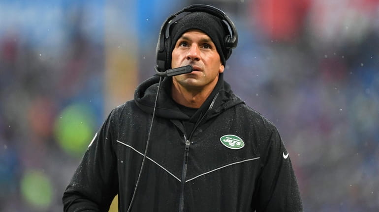 Jets head coach Robert Saleh looks up from the sidelines...