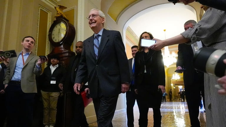 Senate Minority Leader Mitch McConnell of Ky., walks to the...