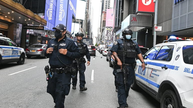 NYPD officers patrol the Times Square area in May. 