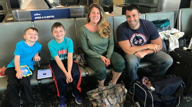 Melissa and Steve Gambardella of Bellmore and their sons, Nicholas,...