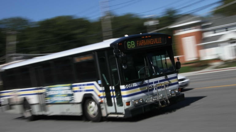 A Suffolk Transit bus travels on Route 25 in Lake...