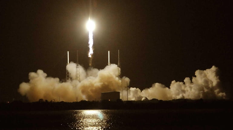 SpaceX's Falcon 9 rocket blasts off from Cape Canaveral, Fla.,...