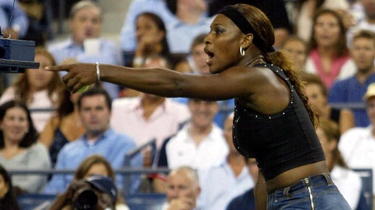 Serena Williams argues a line call during her match against...