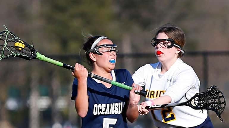 Lucia Alamia #5 of Oceanside battles for the ball against...