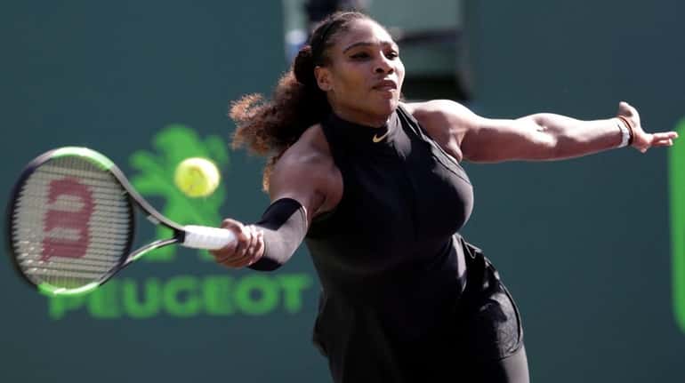 Serena Williams makes a return against Naomi Osaka during the...