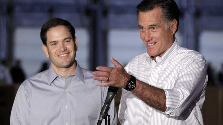 Mitt Romney and Sen. Marco Rubio talk to reporters in...